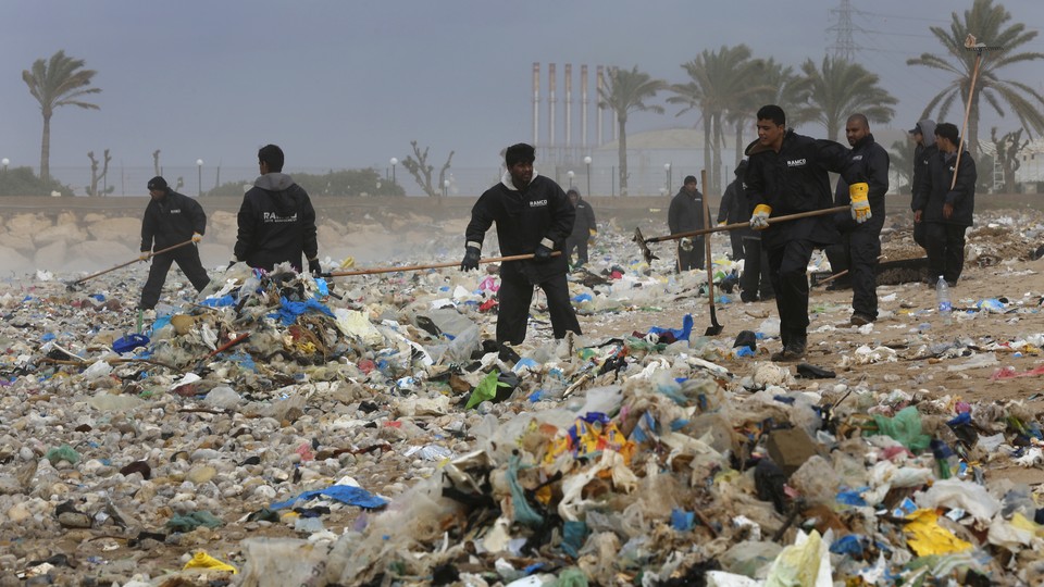Enormous piles of trash are seen on a Lebanese beach.