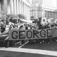 photo of protesters with 'George Floyd' banner