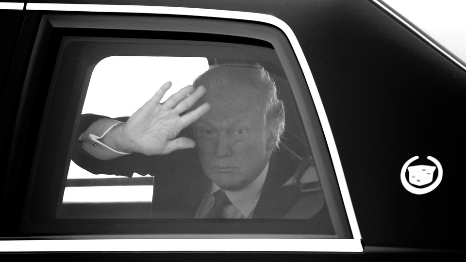Trump waving from a car