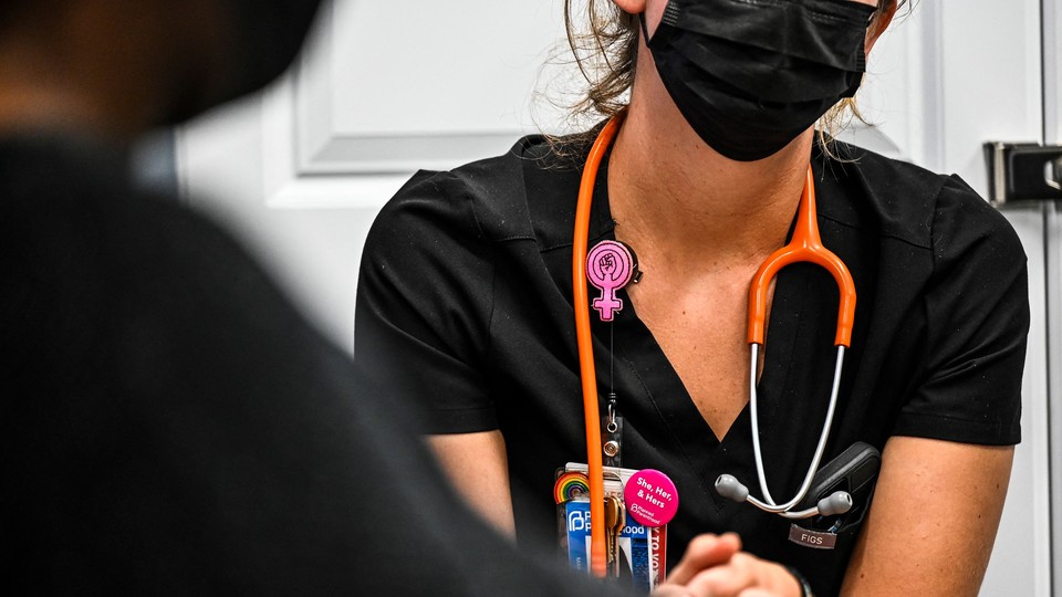 A worker at a Planned Parenthood in Florida checks the vitals of a woman who wants an abortion