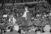 Aimee Semple McPherson speaking in front of a large crowd