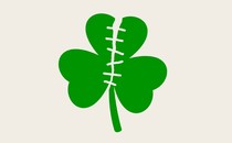 An illustration of a green shamrock ripped in half and stitched back up