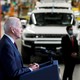 A photo of Joe Biden giving a speech in an auto factory