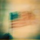 A blurry American flag waving
