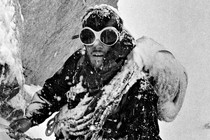 Photo of Douglas Tompkins climbing in snow, 1968