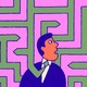 A man in a tie standing in the middle of a maze