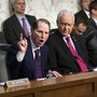 Democratic Senator Ron Wyden of Oregon argues with Republican Orrin Hatch of Utah during a committee debate over taxes.