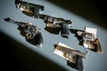 Recently seized handguns are displayed at the Boston police headquarters in Massachusetts on December 7, 2005.