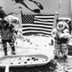 NASA astronauts practice for a future moon landing inside a training pool at Johnson Space Center
