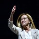 Italian politician Giorgia Meloni smiling and waving