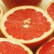 An array of pink grapefruit cut in half