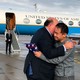 A man wearing a suit hugs the Chinese American graduate student Xiyue Wang in Zurich, Switzerland, on a tarmac in front of an American diplomatic jet.
