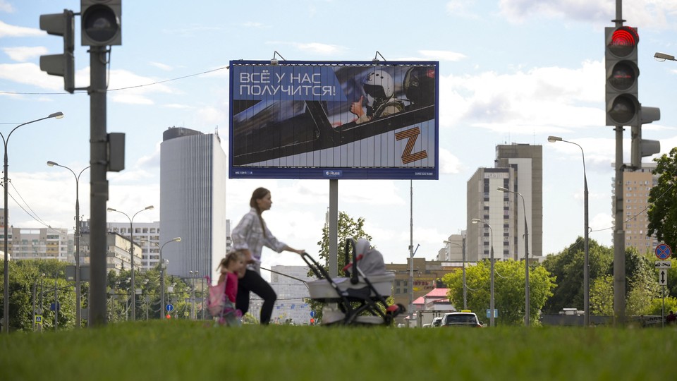 A woman pushing a stroller in Moscow