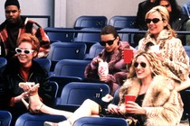 Carrie, Samantha, Miranda, and Charlotte wear sunglasses and watch a baseball game