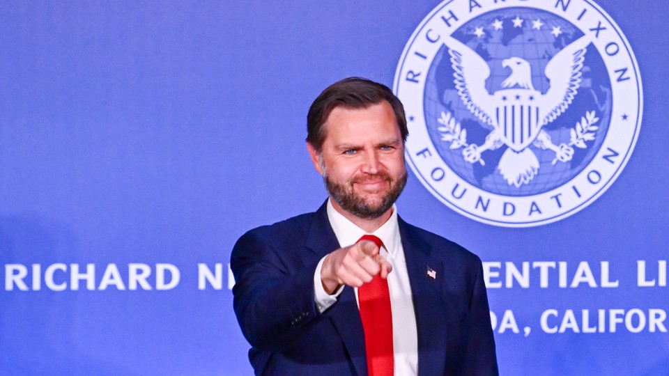 A photo of JD Vance smiling and pointing