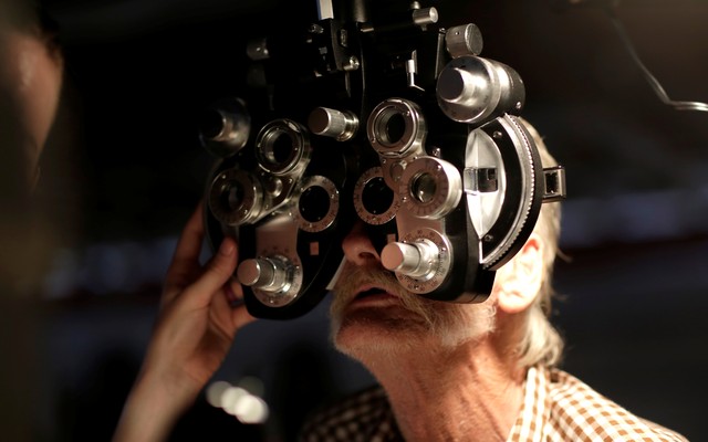 Someone receives an eye exam.