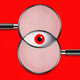 Illustration showing two overlapping magnifying glasses, the intersection of the two circles producing the shape of a red eye.