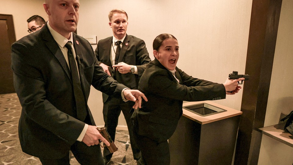 Photo of Secret Service agents with guns drawn