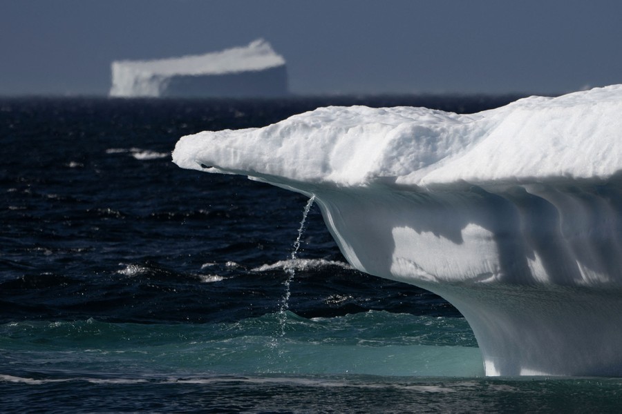 Water flows in a small stream from a melting iceberg.