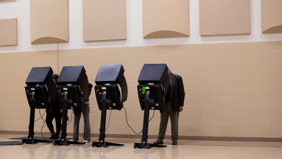 Voters cast their ballots at a polling location