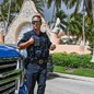 Police officer standing in front of Mar-a-lago