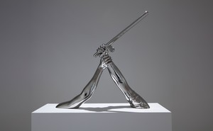 A photo of 'Strike' (2018) by Hank Willis Thomas: a sculpture of one arm holding another arm with a baton