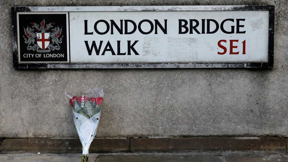 Flowers for the victims at the scene of a stabbing on London Bridge, in which two people were killed, November 30, 2019