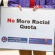 A sign says "No More Racial Quota"