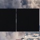 Photo of smoke rising from Gaza, obscured by black squares