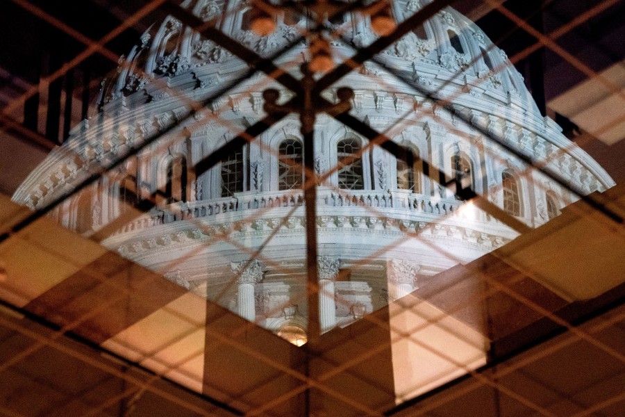 A view through a glass ceiling of the dome of the U.S. Capitol