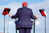 Donald Trump faces away from the camera during a campaign event