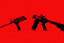 A broken AR-15 assault rifle on a red background
