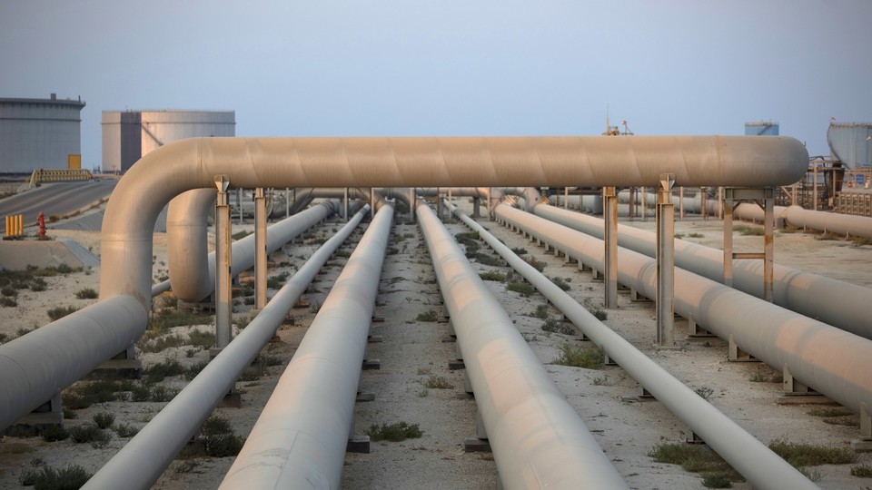 Photograph of a set of industrial pipelines in the desert