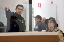 A traveler is directed as she passes through U.S. Customs and Immigration.