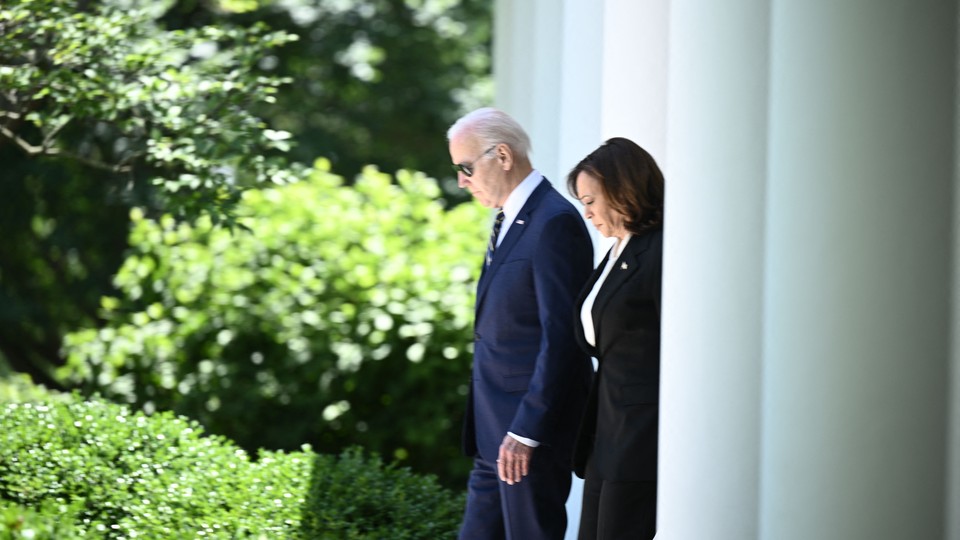 Biden and Harris step into the White House Rose Garden.