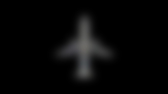 A blurry plane on a black background