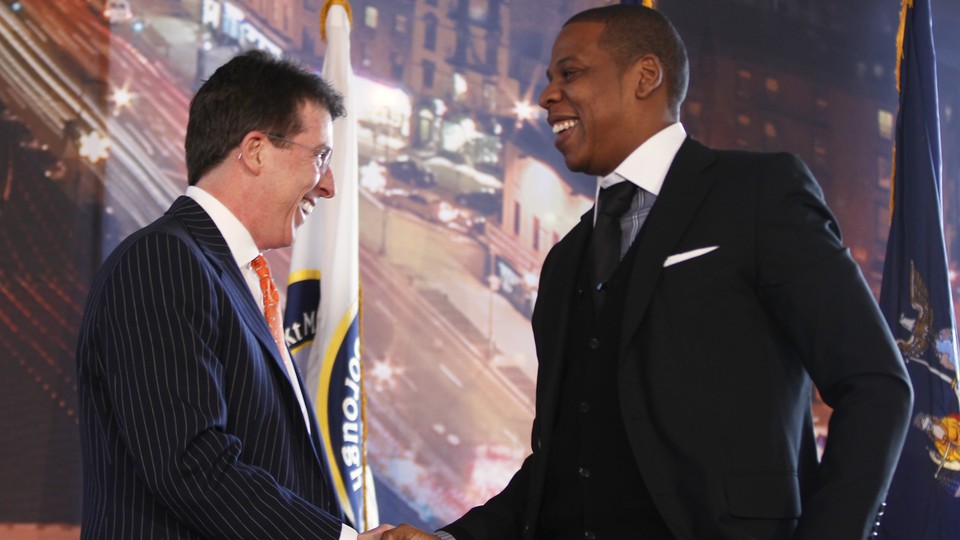 Robert Diamond shakes hands with Jay-Z