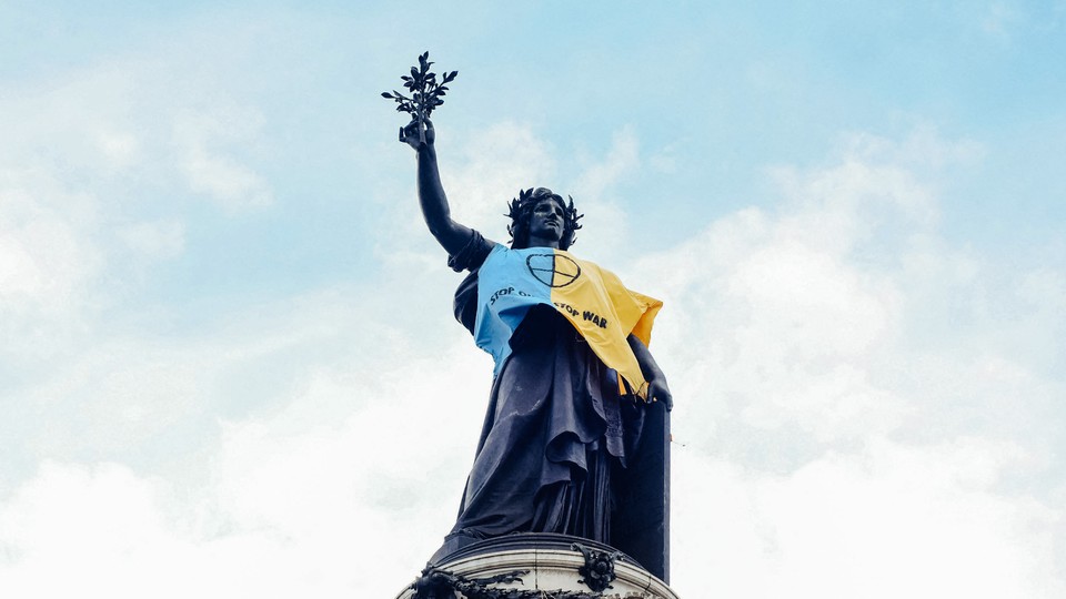 A photo of a statue wearing blue and yellow to represent Ukraine