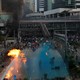 Riot police spray blue-colored water during a protest on China's National Day in Hong Kong.