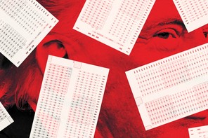 Red-tinted picture of Donald Trump, barely visible under some test papers.