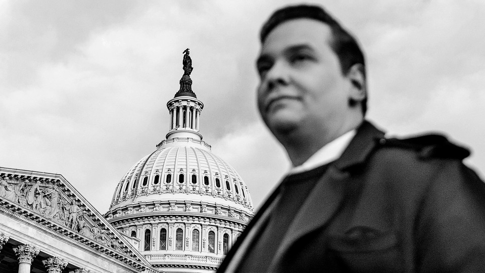 A photo of George Santos in front of the U.S. Capitol