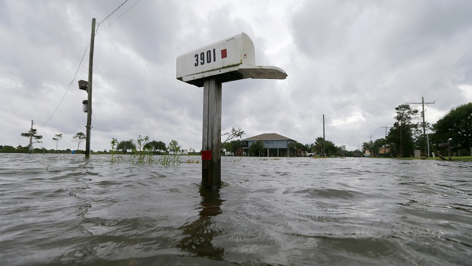 A mailbox is partially underwater after flooding in Big Lake, Louisiana, in June.