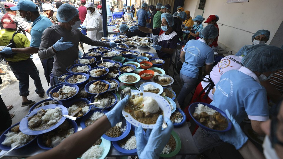 Volunteers prepare free lunches at a shelter near Cúcuta, Colombia.