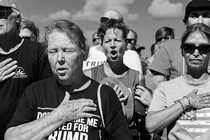 Black and white photo of Trump rally attendees