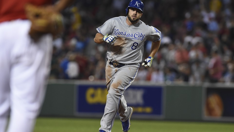 The Kansas City Royals third baseman Mike Moustakas (8) rounds the bases after hitting a three-run home run during the fourth inning against the Boston Red Sox at Fenway Park.