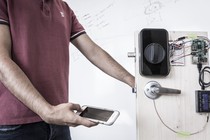 An engineer uses a smartphone's fingerprint reader to send a passcode through his body