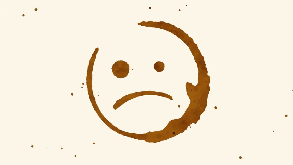 a sad face that looks like a coffee stain