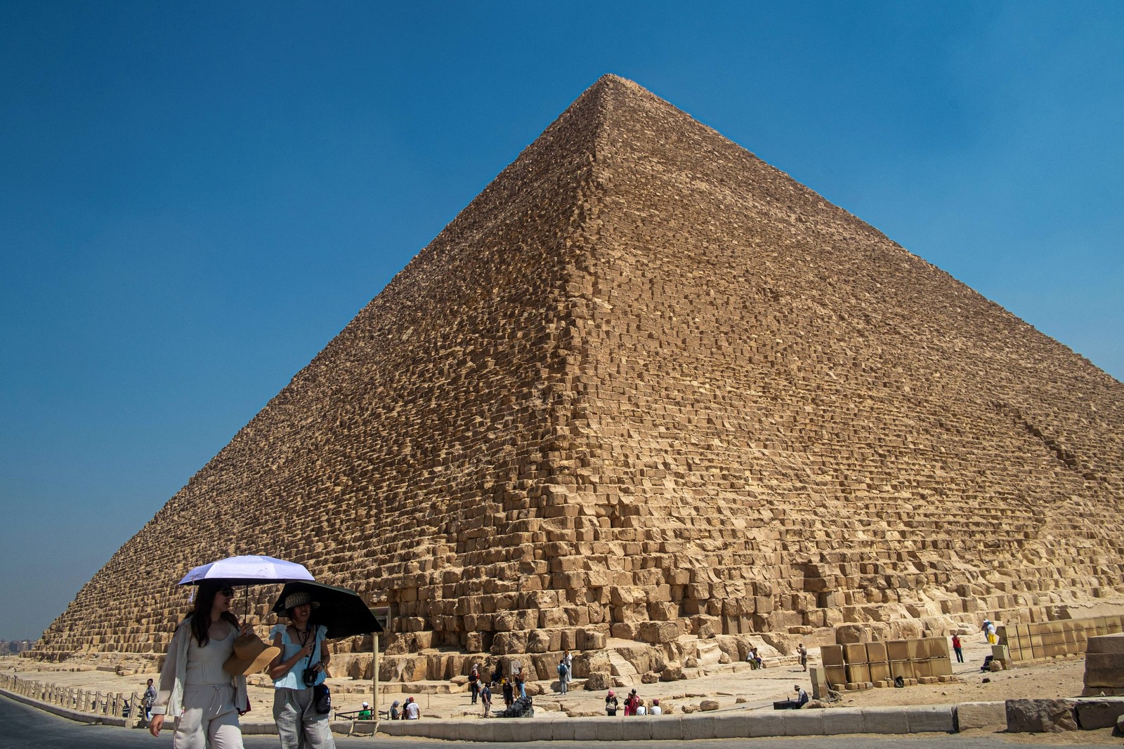 A photo looking up toward the top of one of the pyramids of Giza, from near its base