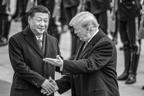 black-and-white photo of Xi Jinping reaching to shake Donald Trump's hand as Trump gestures, with row of uniformed guards at attention in background