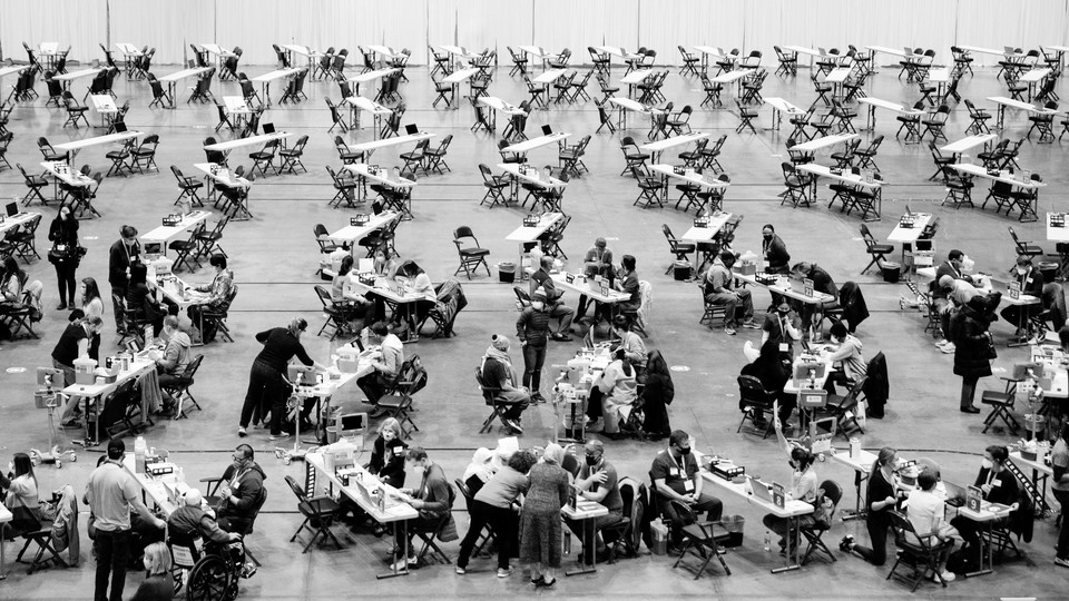 People receiving vaccines at a mass vaccination site in Seattle, Washington.